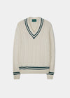 Men's ecru vee neck cable knit cricket jumper with dark navy trim.