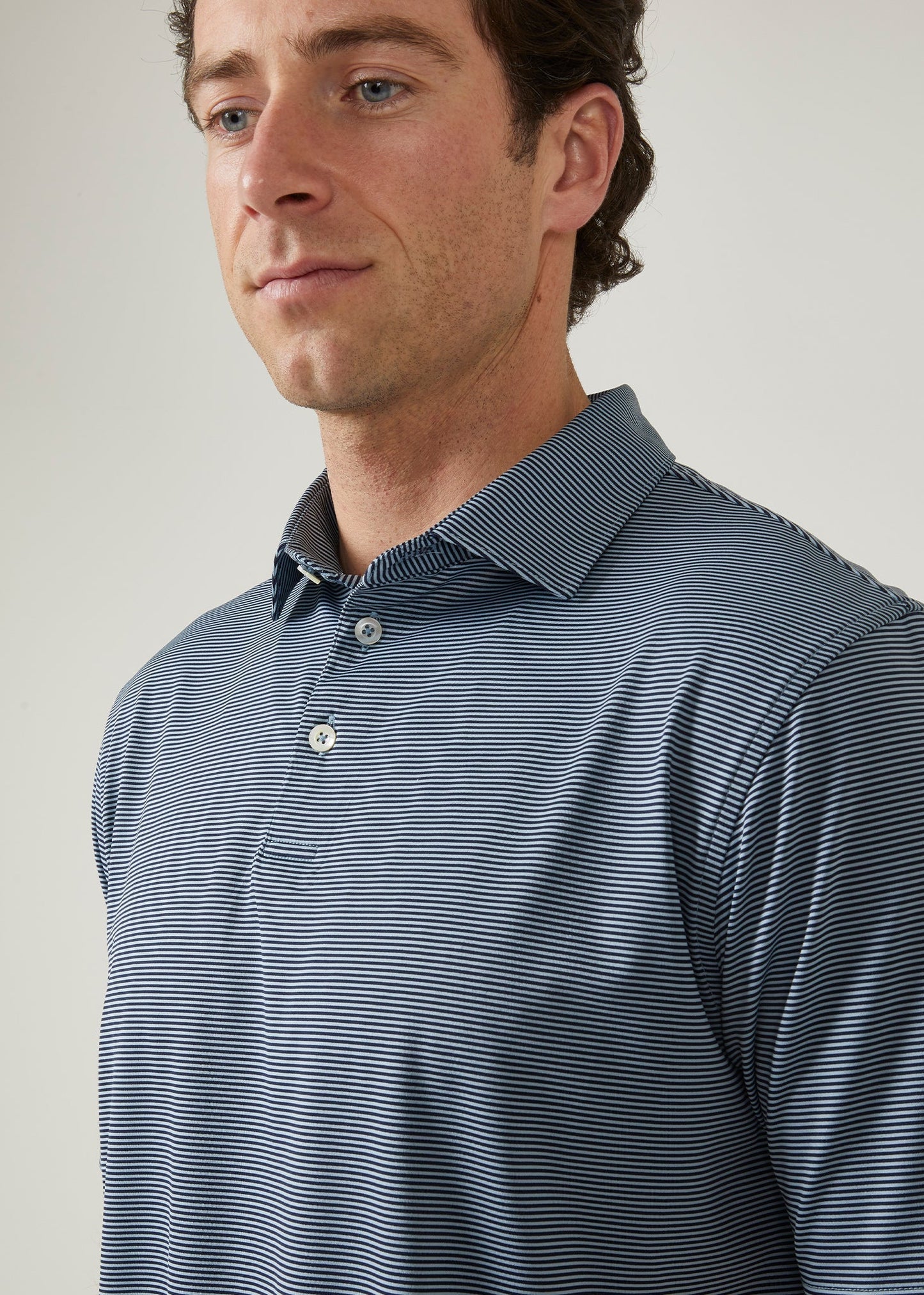 3 button short sleeve polo with Navy & light blue stipes.